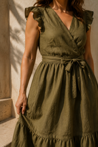 Olive green linen tiered midi dress, fabric detail, flax weave in raking light