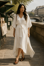 Ivory linen a-line midi dress, lifestyle, warm afternoon by white arches