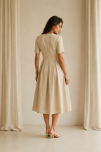 Beige linen a-line midi dress, back view, smooth back and defined waist