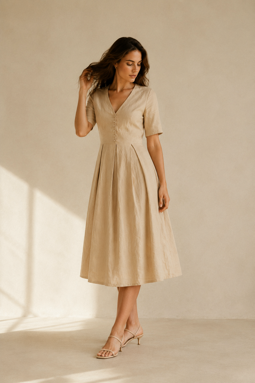 Beige linen a-line midi dress, three-quarter view, fluid skirt and relaxed short sleeves