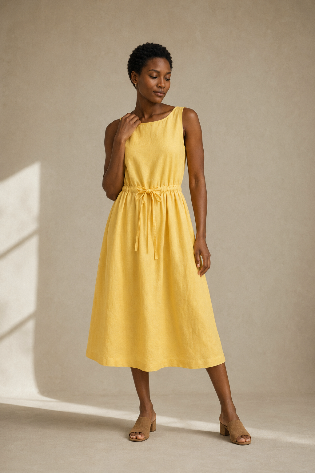 Yellow linen a-line midi dress, full front view, relaxed bodice and A-line skirt