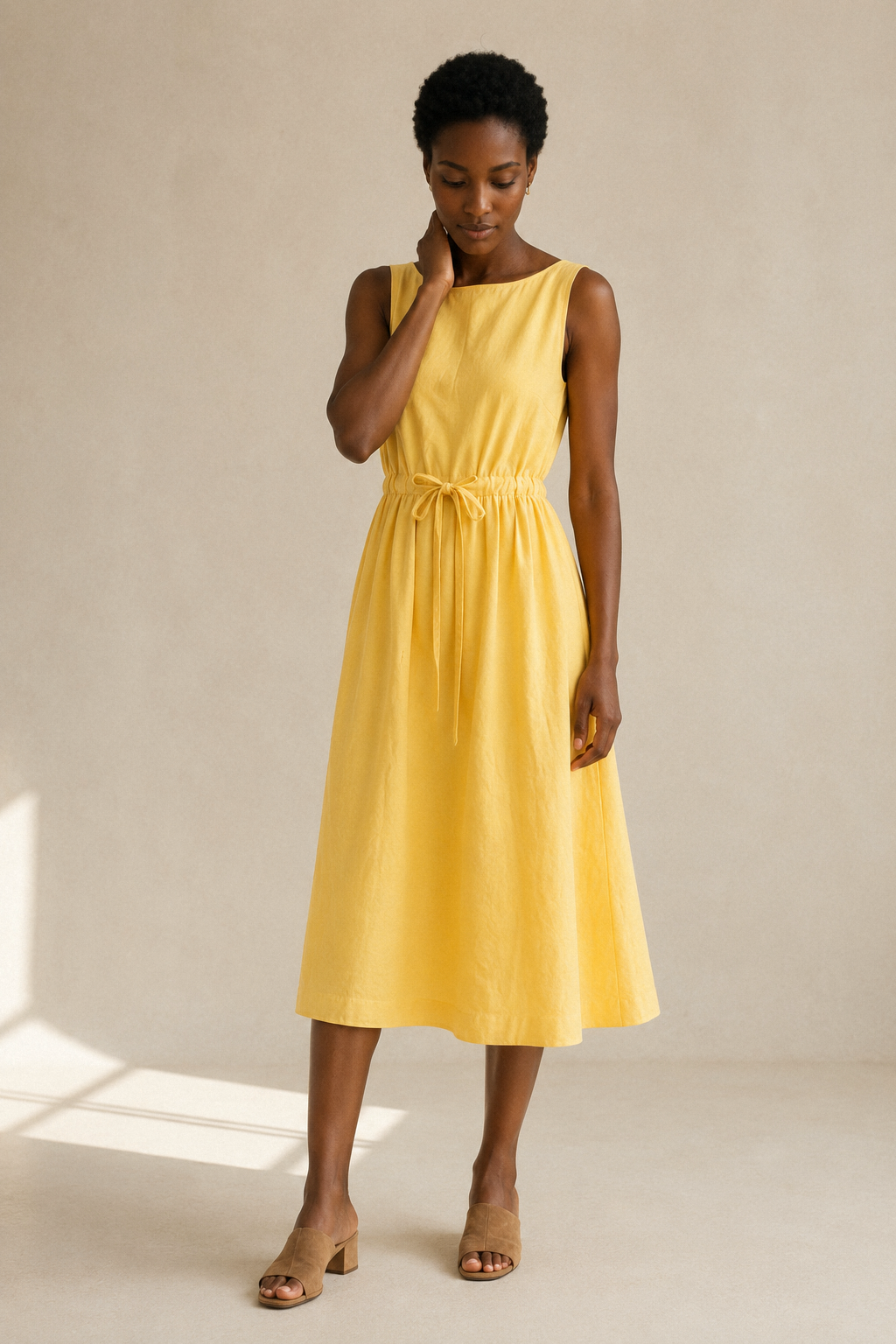 Yellow linen a-line midi dress, three-quarter view, midi length and fluid linen