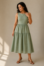 Sage green linen tiered midi dress, full front view, tiered skirt and fitted bodice