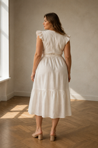 Ivory linen wrap midi dress, back view, defined waist, soft skirt, gentle movement