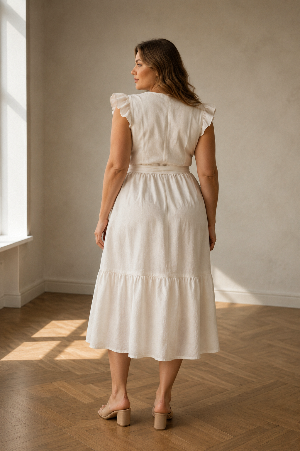 Ivory linen wrap midi dress, back view, defined waist, soft skirt, gentle movement