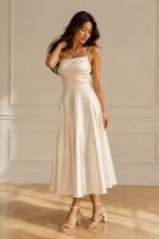 Ivory silk a-line midi dress, three-quarter view, bodice drape and skirt movement