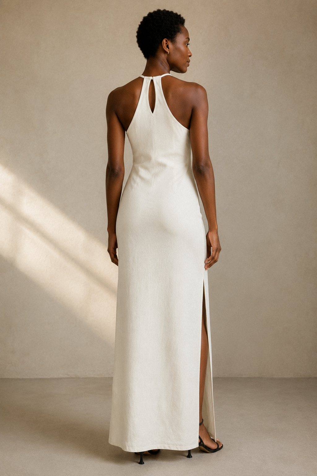 Ivory linen column midi dress, back view, halter neck and clean back line