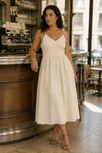 Ivory linen a-line midi dress, lifestyle, seaside stroll in soft light
