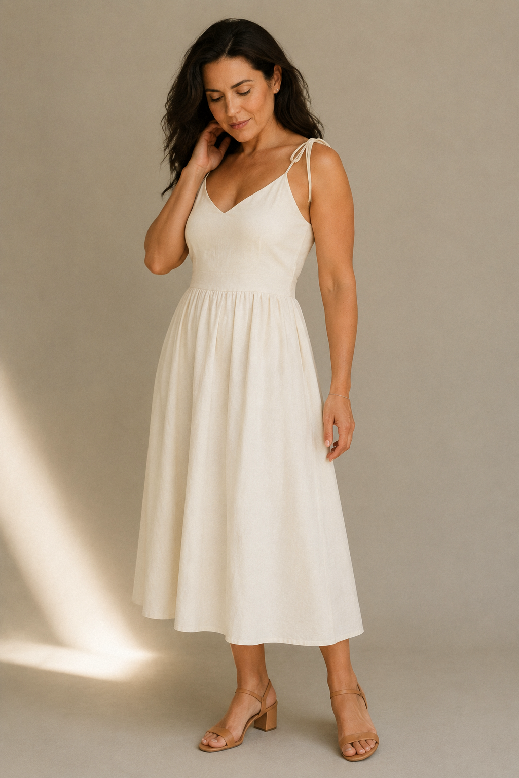 Ivory linen a-line midi dress, three-quarter view, relaxed fit and natural drape