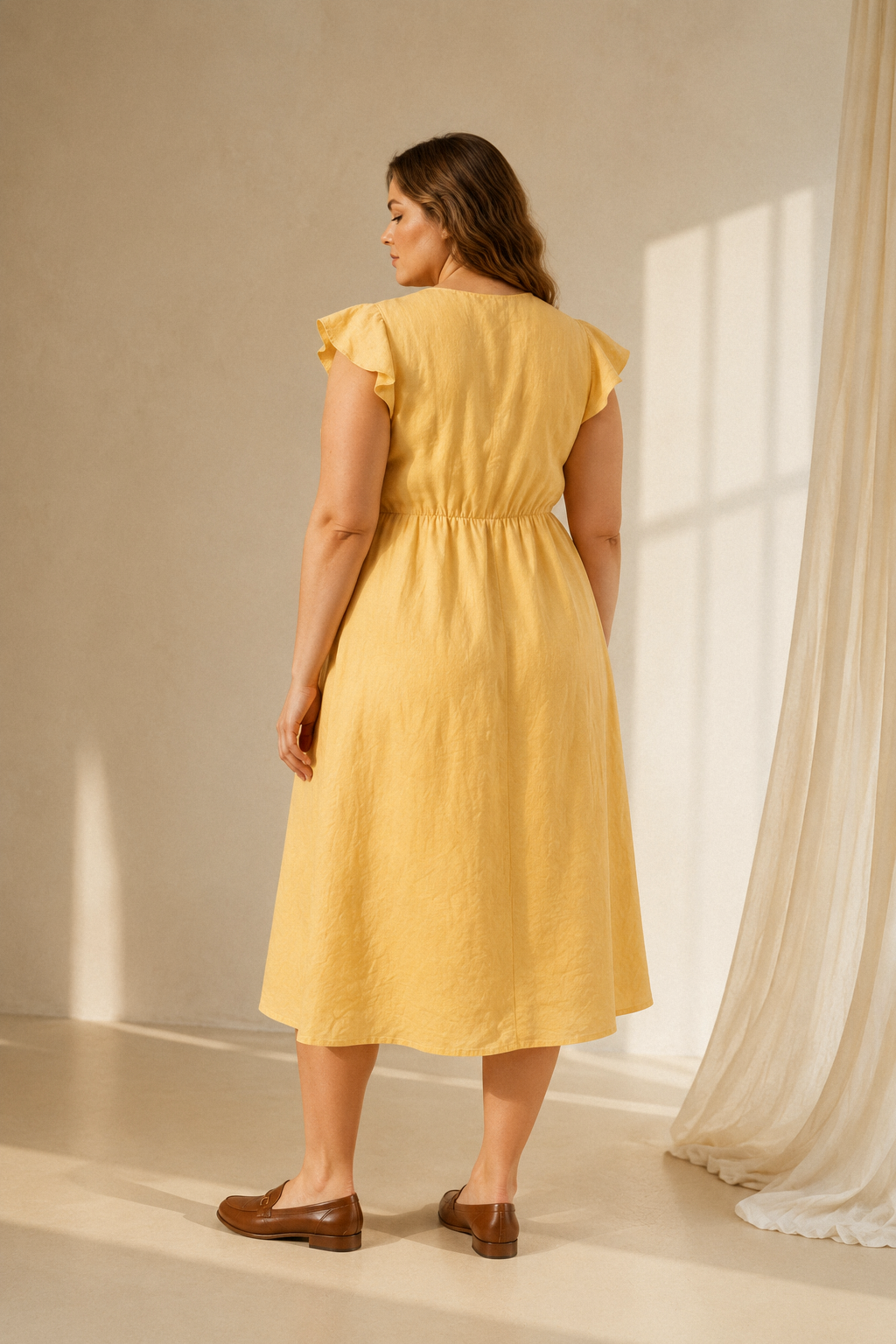 Butter yellow linen a-line midi dress, back view, defined waist and soft skirt drape