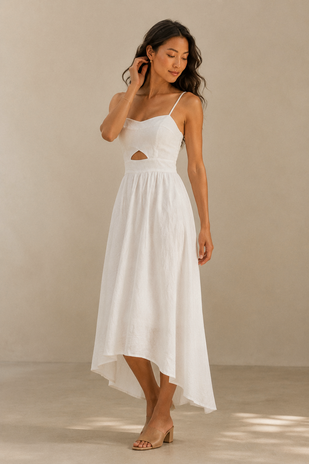 White linen a-line midi dress, three-quarter view, sweetheart bust and flowing skirt