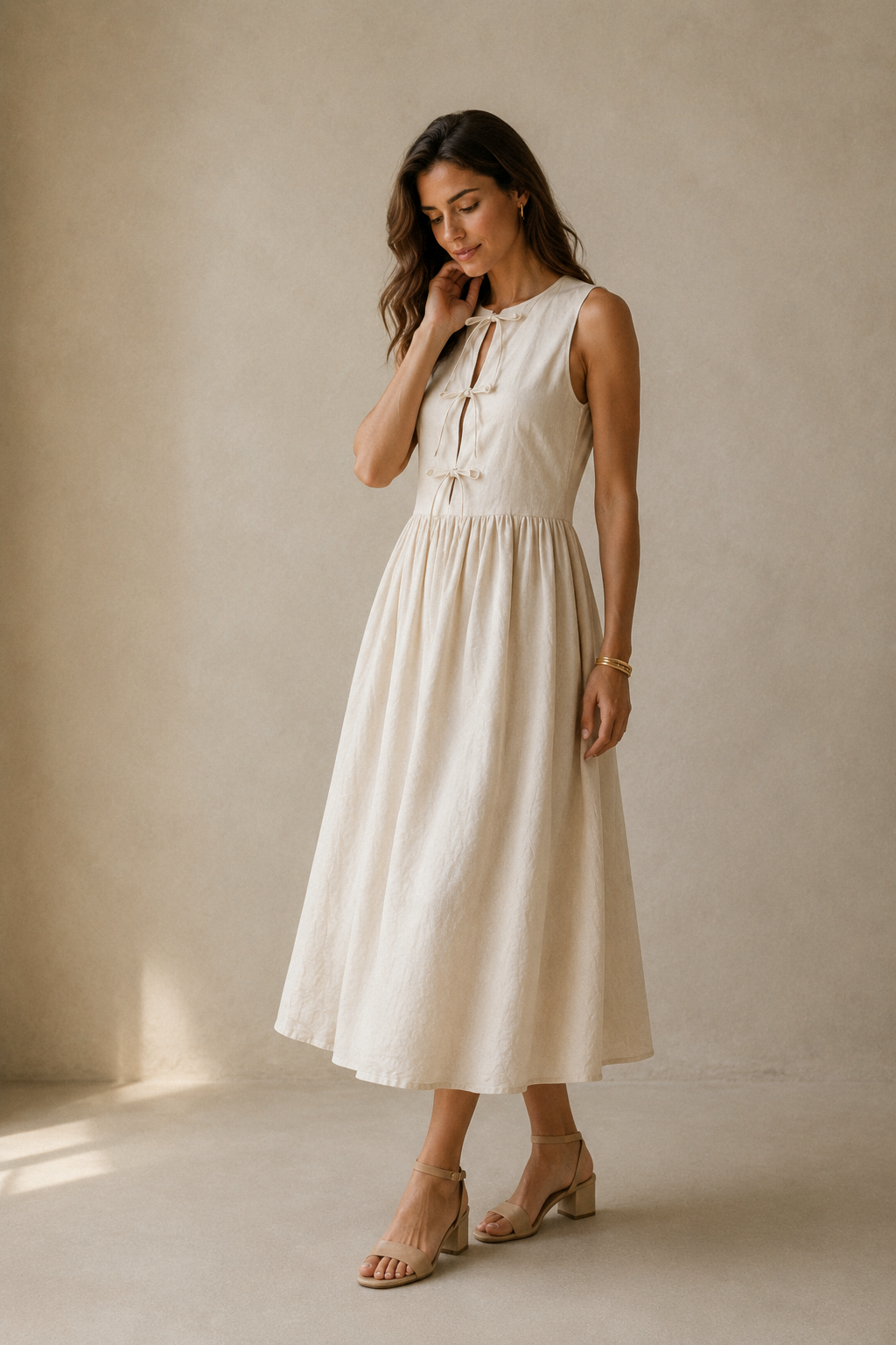 Ivory linen a-line midi dress, three-quarter view, skirt movement and soft drape