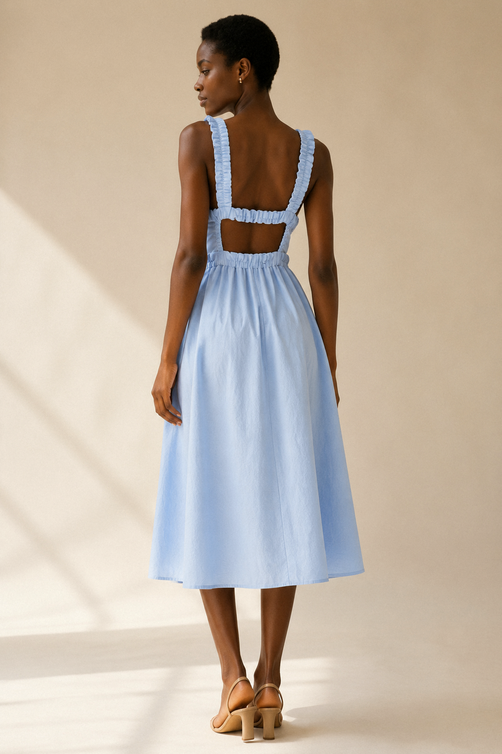 Light blue cotton a-line midi dress, back view, low open back with ruched straps
