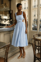 Light blue cotton a-line midi dress, lifestyle, garden stroll in soft light