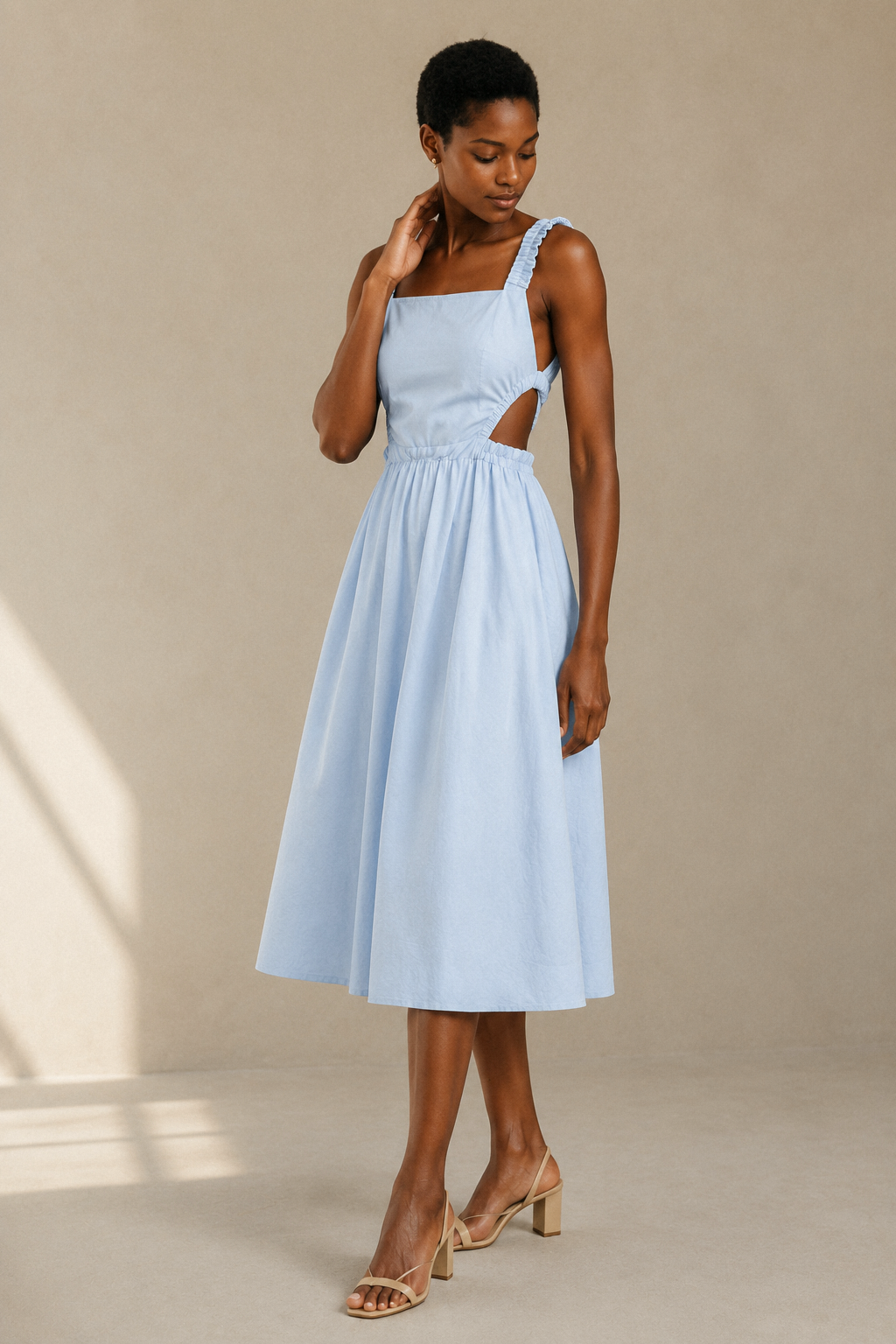 Light blue cotton a-line midi dress, three-quarter view, open back and ruched straps