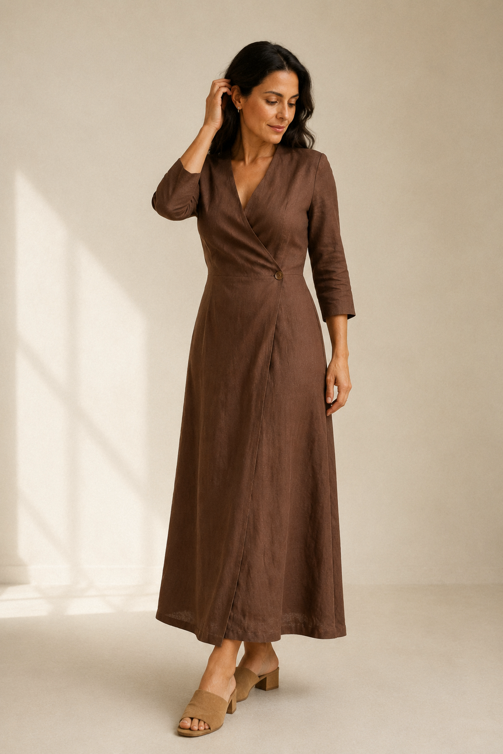 Brown linen wrap midi dress, three-quarter view, wrap silhouette, three-quarter sleeves, side pockets