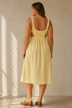 Butter yellow linen a-line midi dress, back view, elasticated waist and sleeveless design