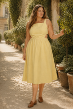 Butter yellow linen a-line midi dress, lifestyle, afternoon stroll in warm light