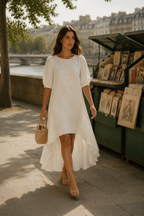 White linen high-low midi dress, lifestyle, sunlit room, relaxed everyday style